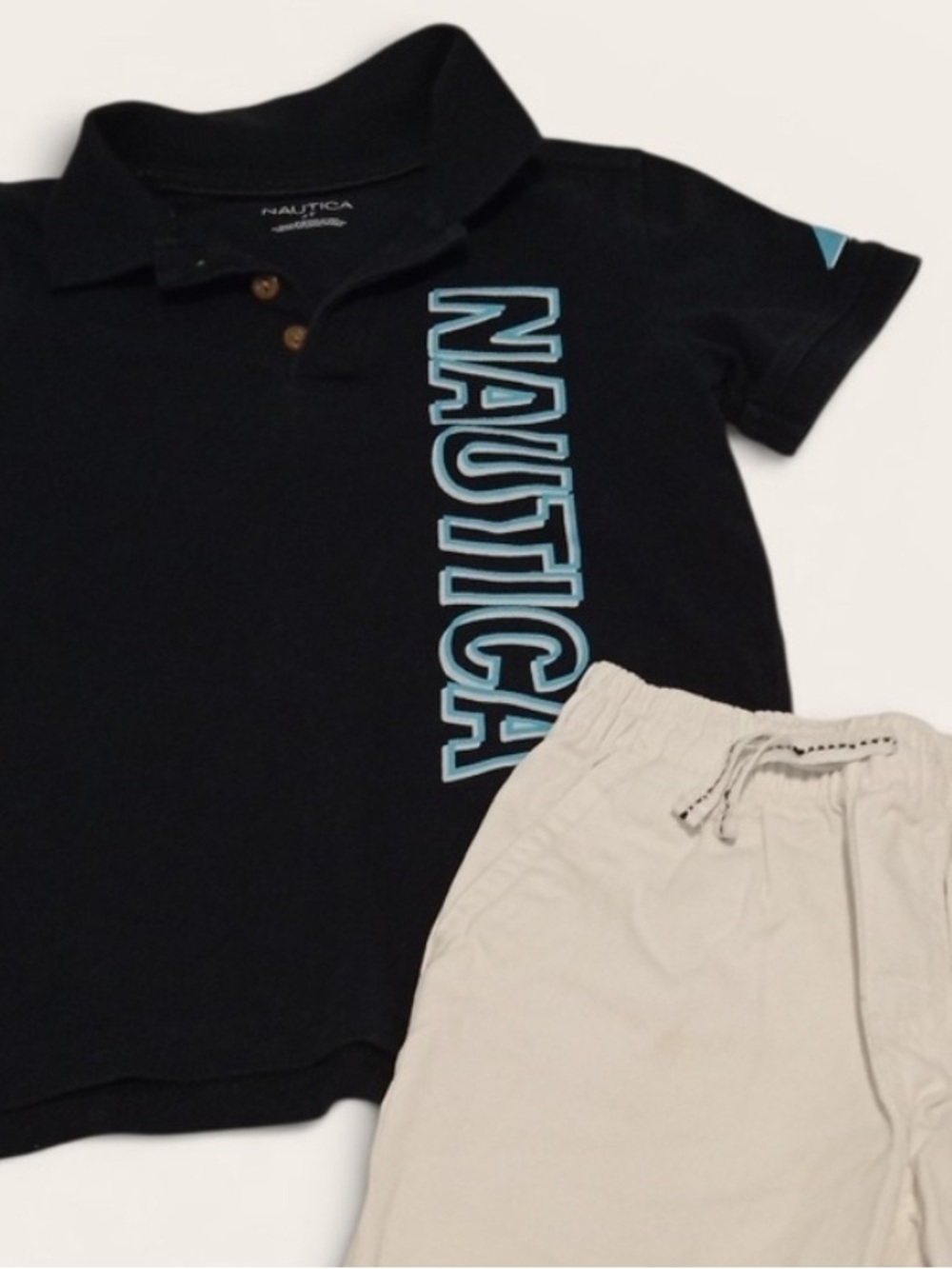 Nautica Navy Polo with Light Blue Logo and White Shorts